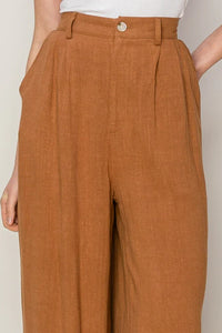 High-waisted caramel brown linen blend pleated wide leg pants for a boho look