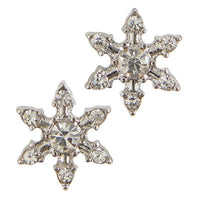 Silver snowflake shaped earrings adorned with rhinestones for a joyful accessory