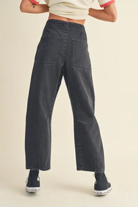 Pair of wide-leg dark gray washed cotton pants featuring visible pockets for style and comfort