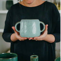 Pale blue Niko Eared Pot featuring a unique design with two handles