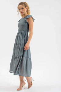 Pale blue smocked tiered midi dress with cap sleeves and a fitted bodice