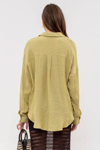 Pale yellow loose oversized button-up shirt for a boho free spirit look