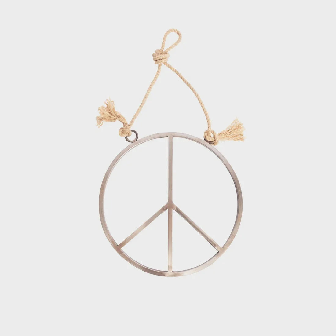 Small hanging metal and jute peace sign displayed on a decorative rope