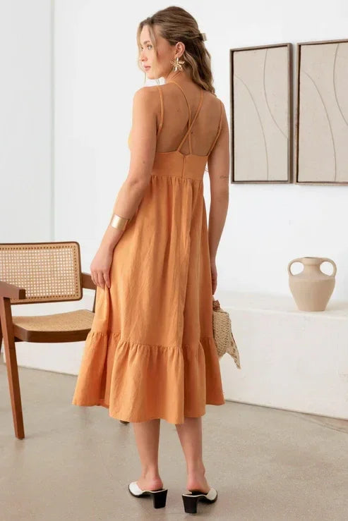 Peach-colored boho double spaghetti tiered midi dress with a flowy skirt