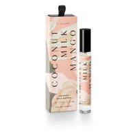 Peach-colored Coconut Milk Mango Petite Perfume Spray with matching box and black top