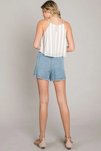 Light blue woven flowy culottes displayed as perfect time shorts for stylish wear