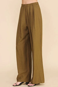 Person wearing flowy textured soft pull-on pants in olive color, showcasing comfort and style