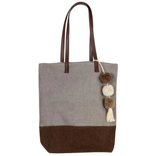 Person holding a Brown and Grey Jute Tote, showcasing its stylish design