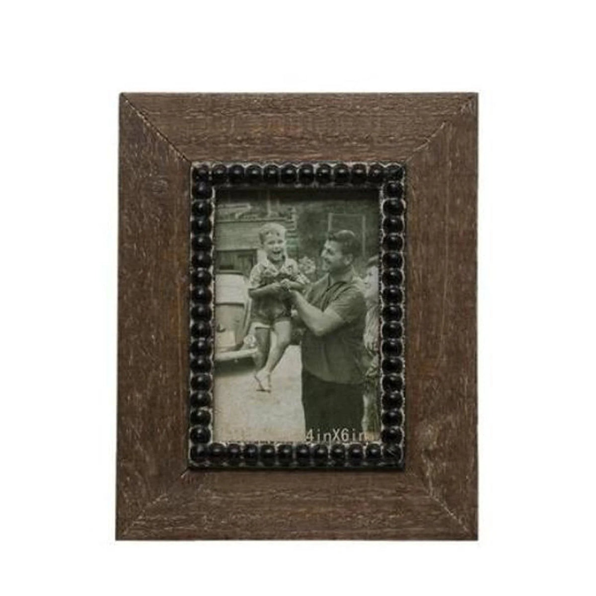 A natural wood photo frame displaying a picture of a man and woman