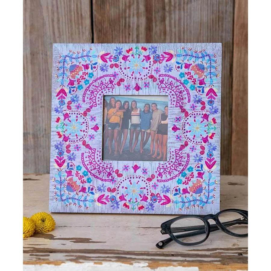 Floral Folk Picture Frame showcasing an image of two girls with floral patterns