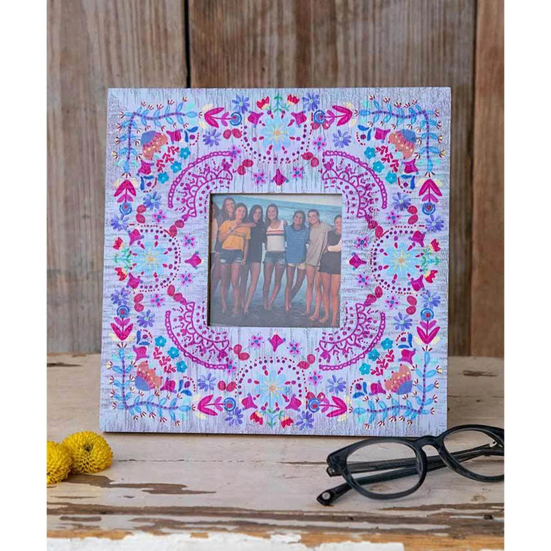 Floral Folk Picture Frame showcasing an image of two girls with floral patterns