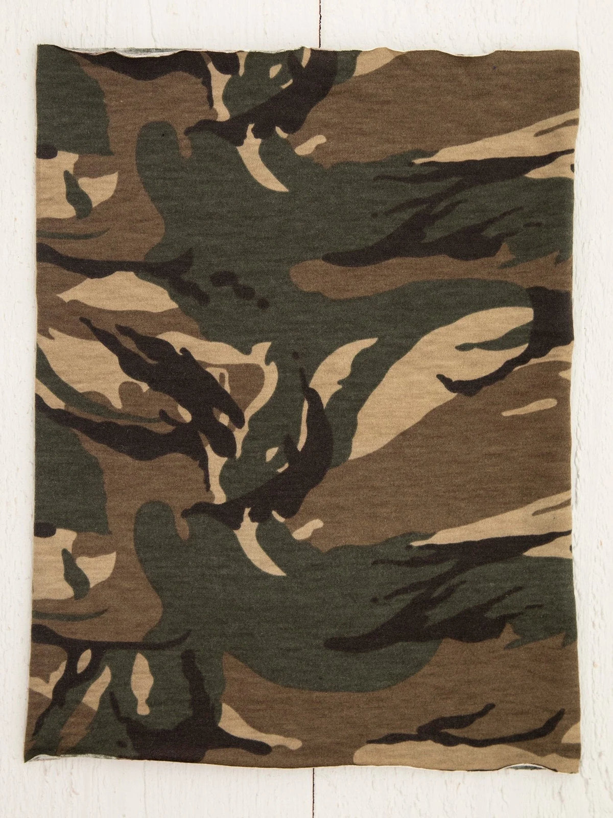 Olive fabric showcasing a woodland camouflage pattern for a Camo Boho Bandeau