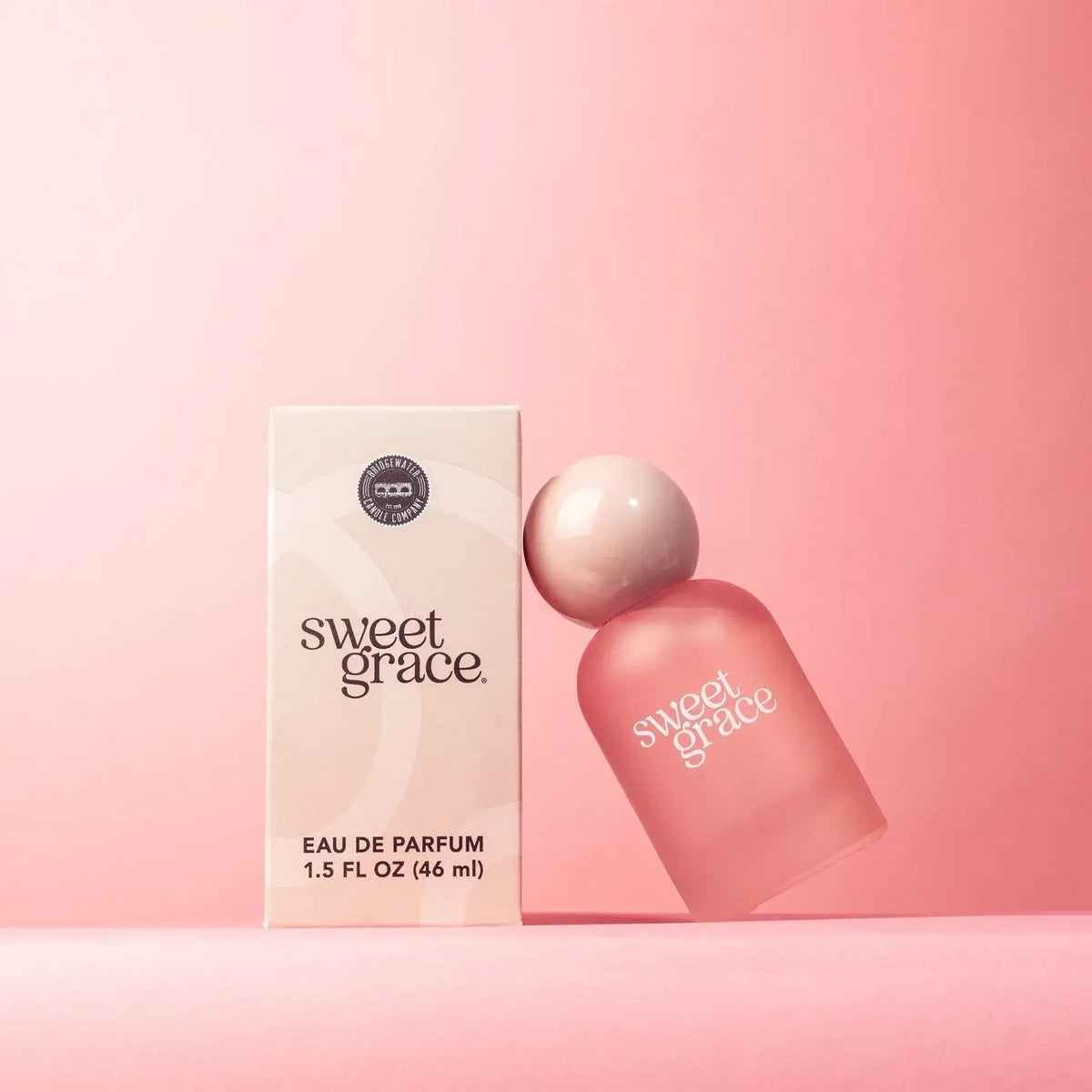 Pink perfume bottle and box for SWEET GRACE EAU DE PARFUM display, ideal for women’s boho chic clothing at Shop Daisy