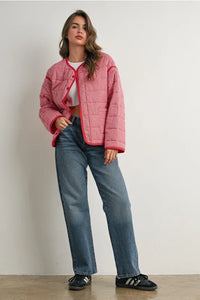 Pink buttoned quilted puffer jacket with red trim and white buttons