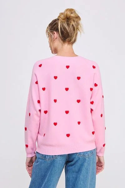 Soft long sleeve sweater with contrast 3D hearts styled with blue jeans