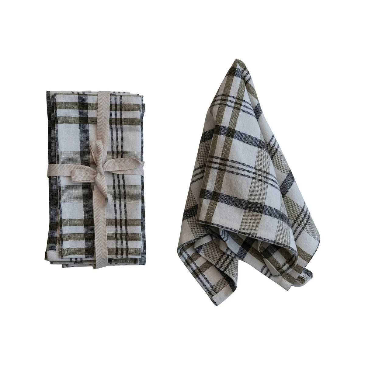 Stonewashed cotton napkins in plaid, elegantly tied with a ribbon and one unfolded