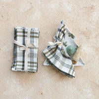 Plaid Stonewashed Cotton Napkins tied with ribbons, showcasing elegance and versatility