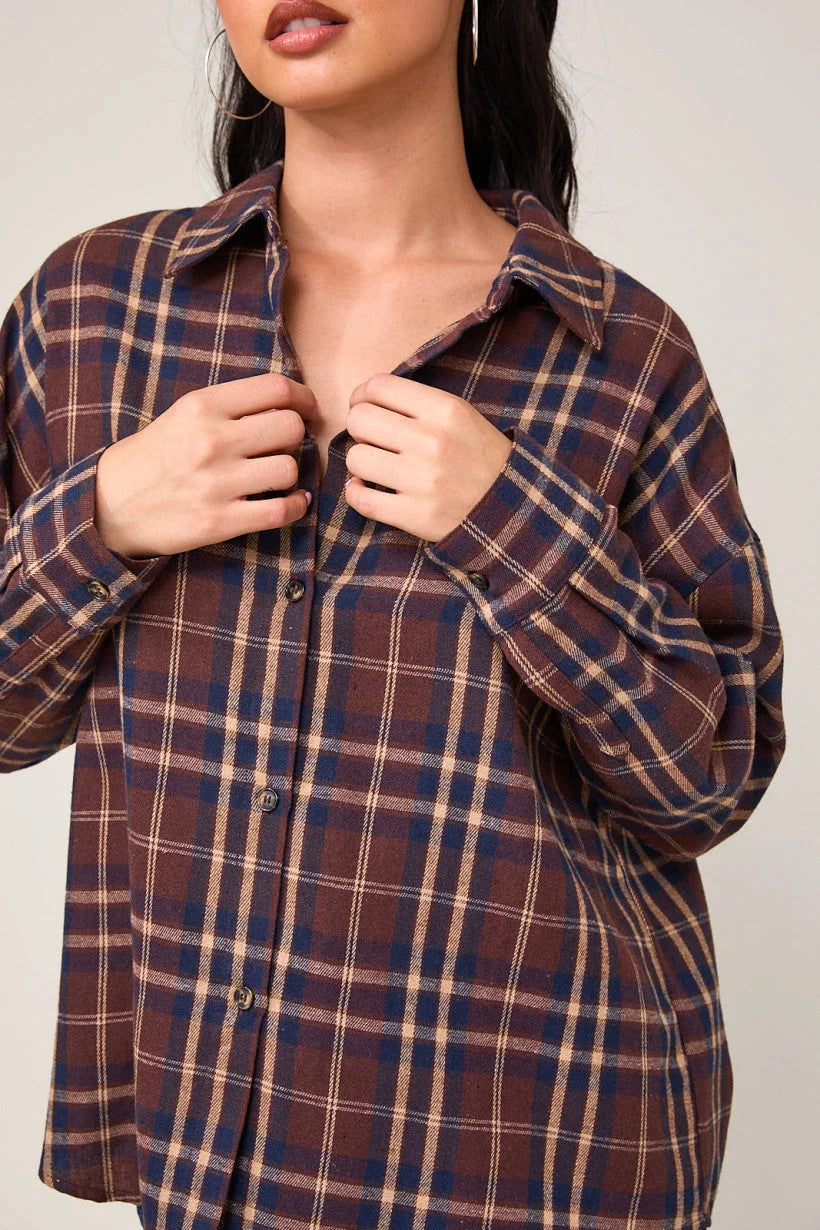 Oversized plaid shirt featuring a collar and button-up design in flannel fabric