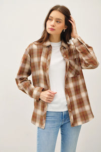 Classic oversized flannel top styled with a white top and blue jeans