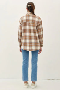 Person wearing a plaid pocket oversize flannel shirt from FRONT POCKET OVERSIZE FLANNEL