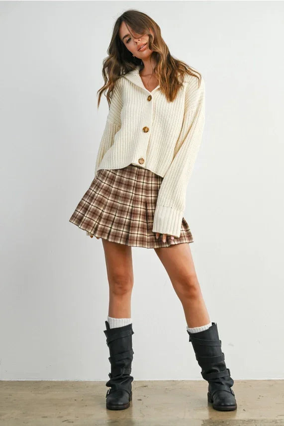 Knit collared V-neck buttoned cardigan with plaid mini skirt