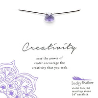 Purple flower on white background for VIOLET CREATIVITY Color Power Necklace