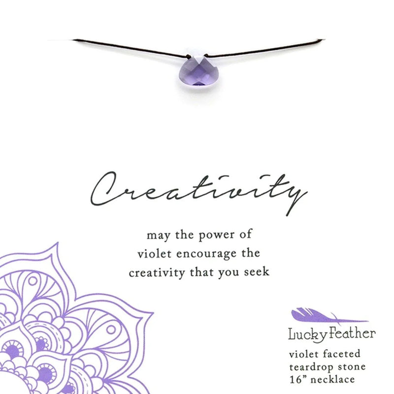 Purple flower on white background for VIOLET CREATIVITY Color Power Necklace