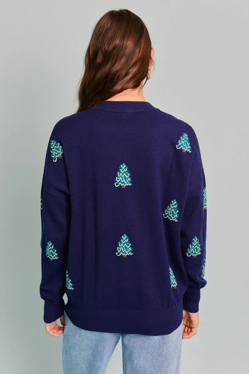 Purple sweater with light blue Christmas tree patterns from Shop Daisy, women’s boho chic clothing