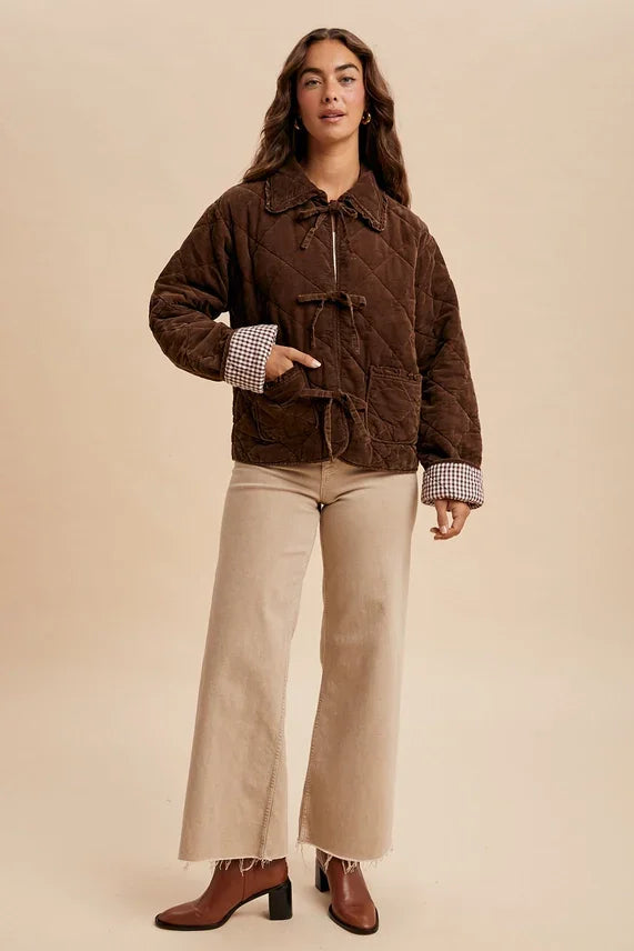 Garment washed quilted corduroy jacket with toggle closures and checkered cuff lining