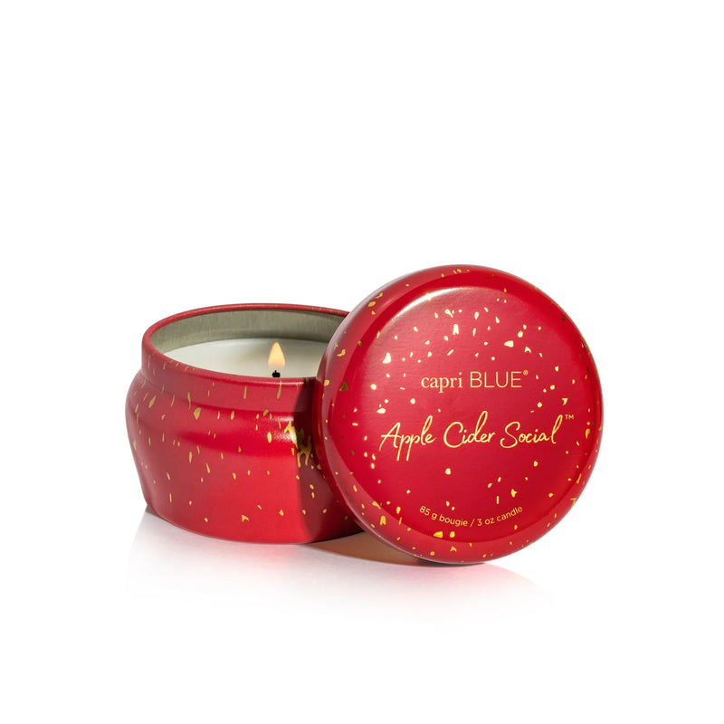 Red apple-shaped tin candle with gold speckles, Capri Blue Apple Cider Social scent