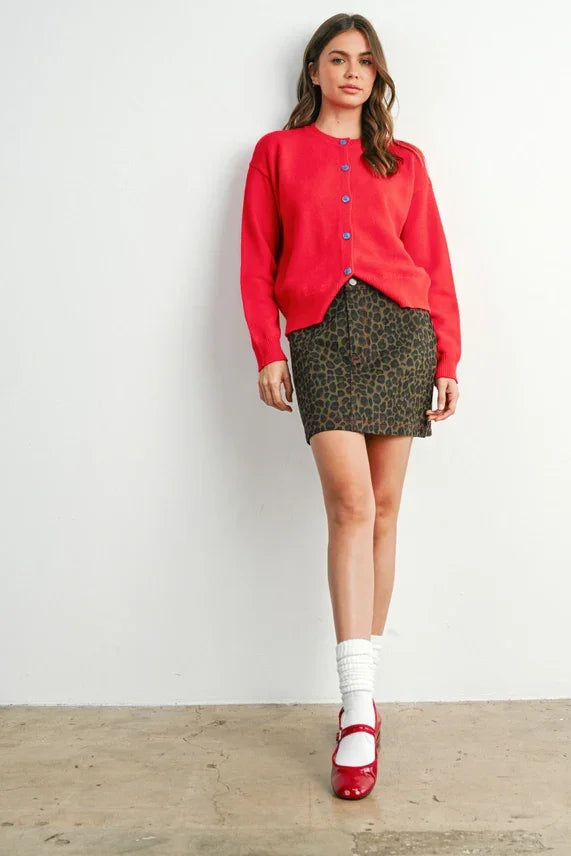 Red button-up cardigan with blue buttons, perfect for leopard print mini skirt and women’s boho chic clothing