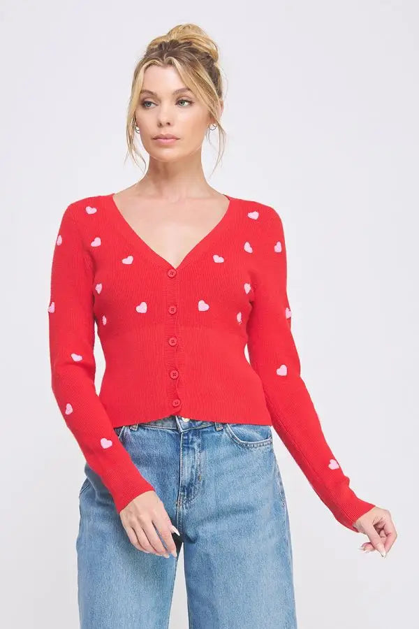 Red cardigan with textured hearts, perfect for women’s boho chic clothing at Shop Daisy