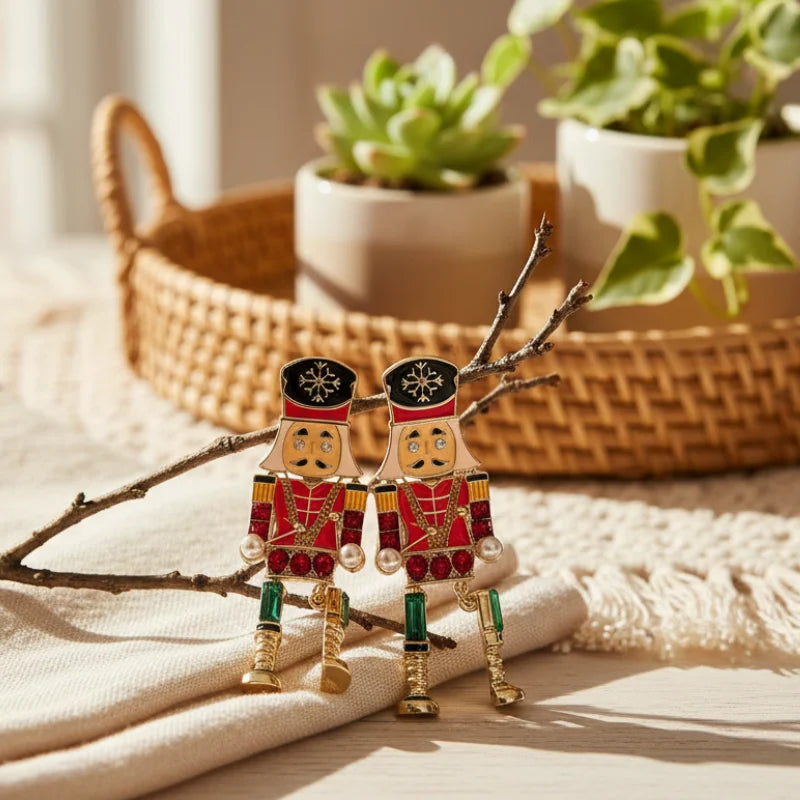 Festive jeweled nutcracker dangle earrings with red green toy soldiers and pearls