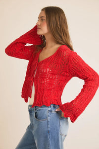 Red open knit cardigan sweater with cable pattern and bell sleeves from Shop Daisy