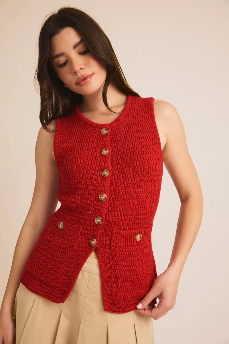 Red knitted sweater vest with brass buttons, a stylish choice from Shop Daisy