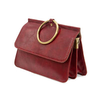 Red leather ARIA RING BAG with gold ring handle and interior zip at its widest point