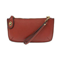 Red leather wristlet clutch with gold-tone hardware and card slots from Shop Daisy