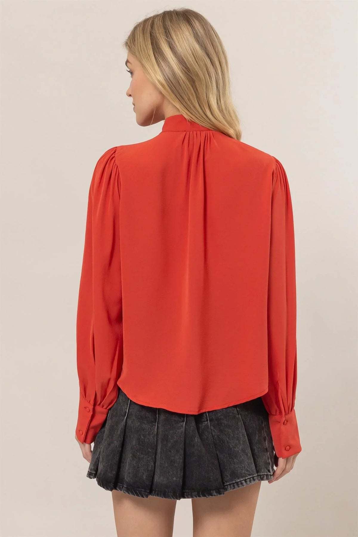 Red long-sleeved gathered shoulder blouse from Shop Daisy, ideal for women’s boho chic clothing