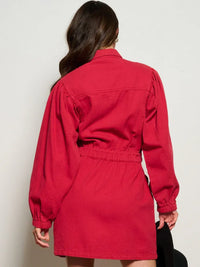 Red long-sleeved denim mini dress with a cinched waist, viewed from the back