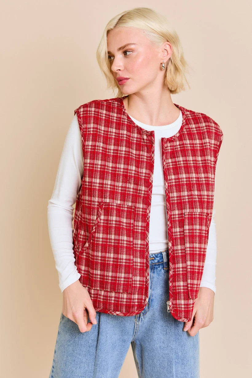 Red plaid quilted vest jacket over a white long-sleeved top from Shop Daisy