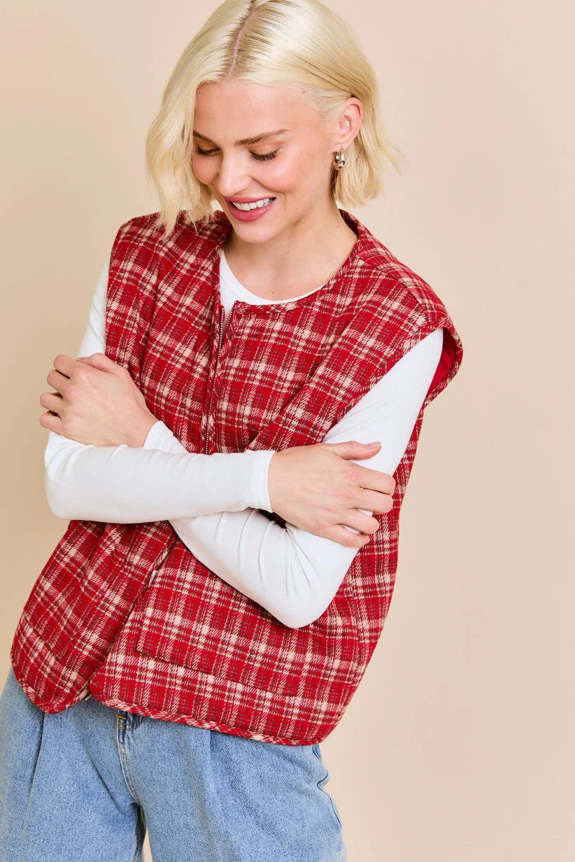 Red plaid sleeveless vest jacket over white long-sleeved shirt from Shop Daisy