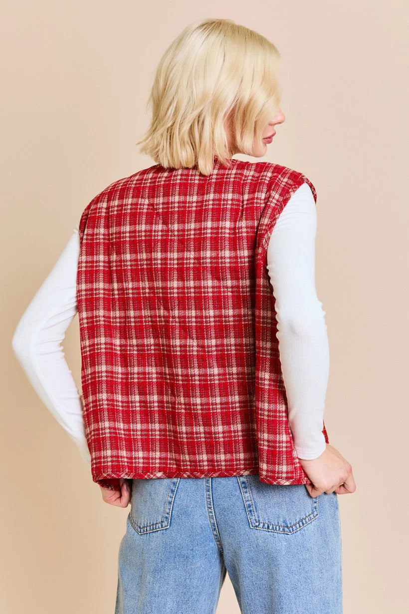 Red plaid vest jacket over a white shirt and blue jeans from Shop Daisy’s women’s boho chic clothing