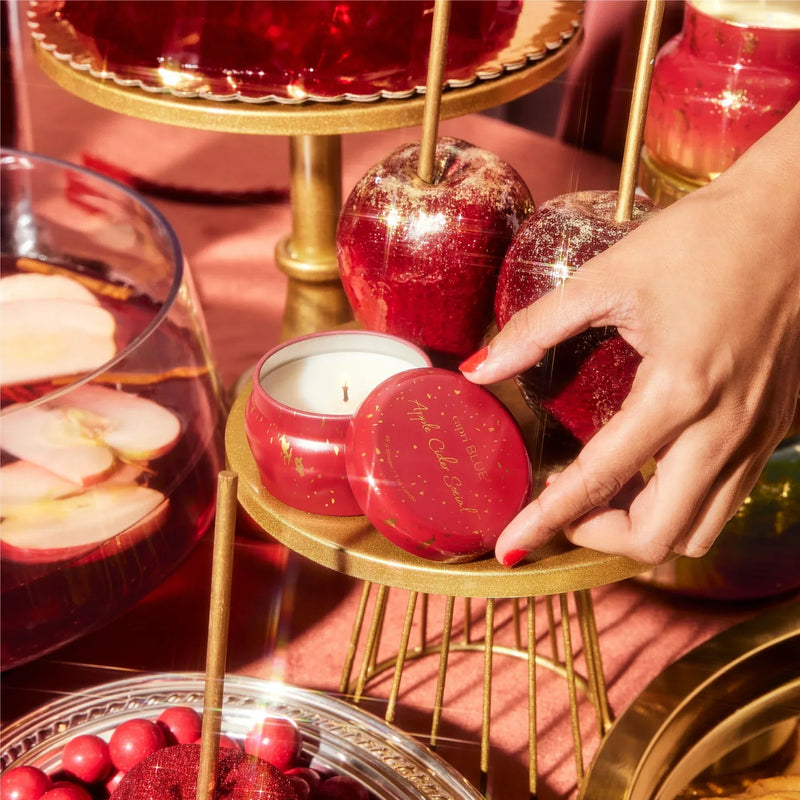 Red round apple cider social glimmer mini tin candle with gold metallic lid and base