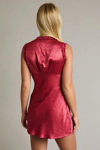 Red sleeveless mini dress with lace trim and ruffled neckline
