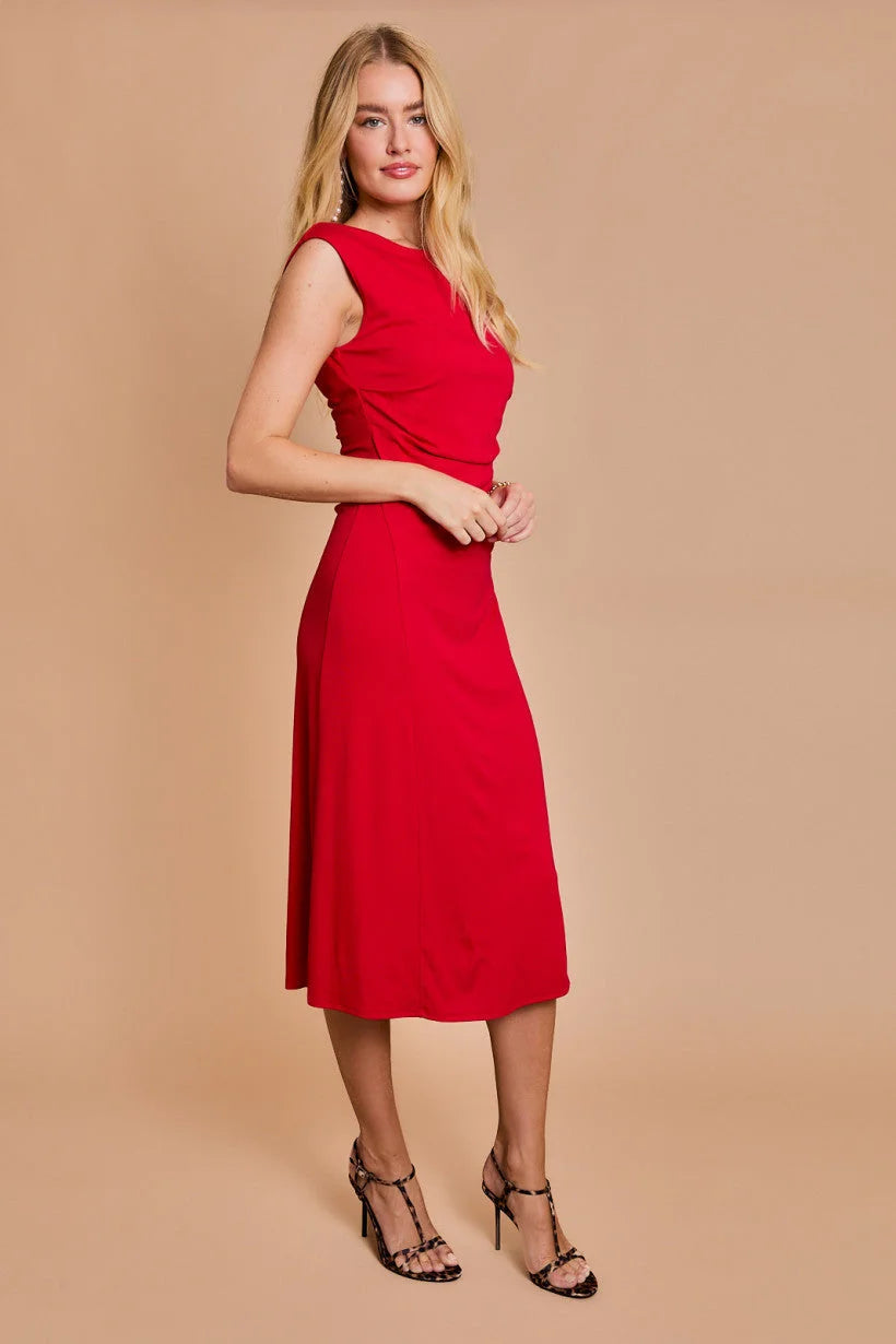 Blonde woman in a red sleeveless midi dress from Shop Daisy’s women’s boho chic clothing