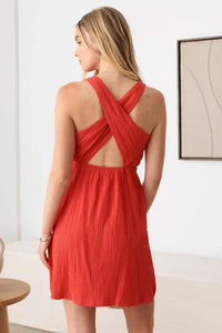 Red flowy mini dress with crisscross back straps in boho style