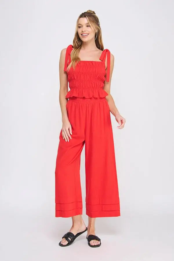 Red two-piece outfit with soft linen smocked tank featuring smocked tie straps