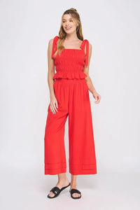 Red two-piece outfit with soft linen smocked tank featuring smocked tie straps