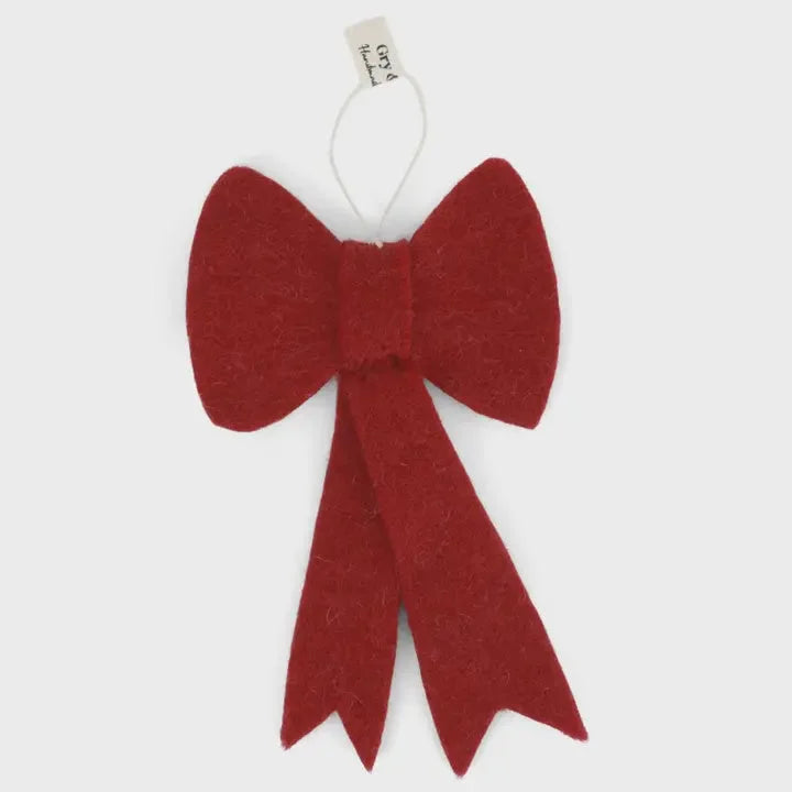 Handmade burgundy bow ornament with hanging loop and brand tag for elegant decor