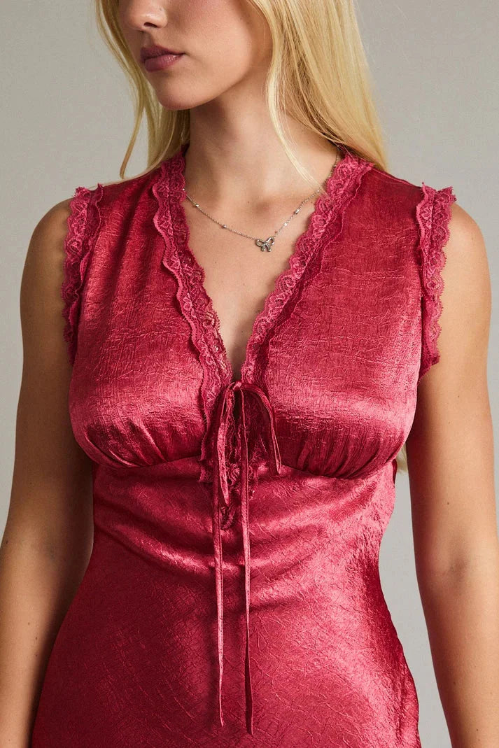 Red velvet sleeveless mini dress with ruffled neckline and lace trim